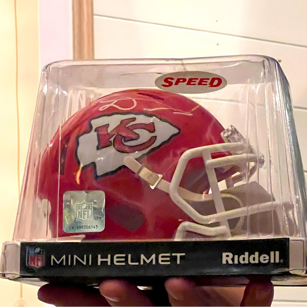This is a mini chiefs signed helmet